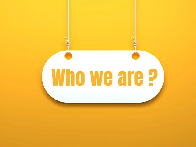 White hanging sign on a yellow background with the words ‘Who we are?’ in bold orange letters.